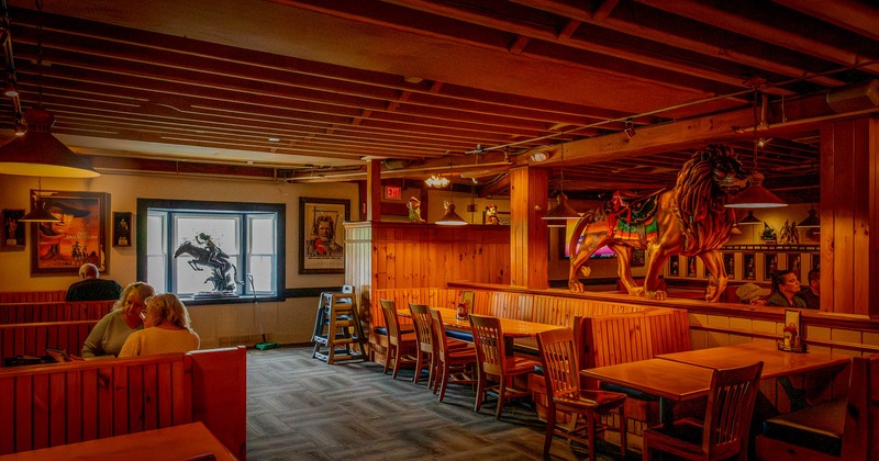 Interior, wooden tables and chairs ready for guests