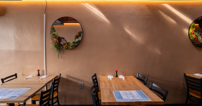 Interior, chairs and tables, round mirrors on the wall
