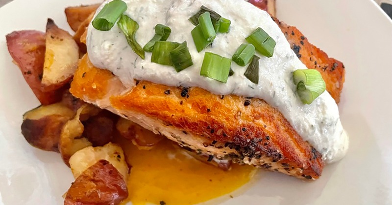 Seared salmon with roasted beet puree, potatoes with a dill horseradish sauce
