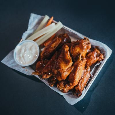 Chicken wings, with carrots, celery, and ranch dressing.