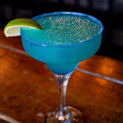 Blue daquiri garnished with a lime slice