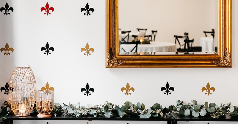 Framed mirror and ornamented wall