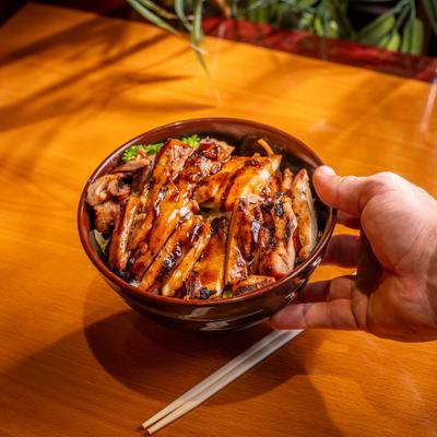 Grilled teriyaki chicken bowl with vegetables.
