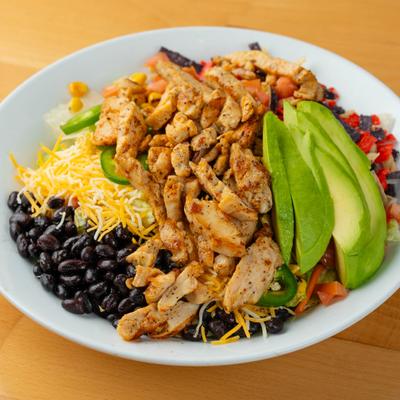 Grilled chicken with salsa, beans, jalapenos, cheese, avocado, and tortilla strips.