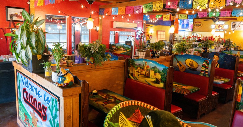 Interior, colorful dining area with seating booths
