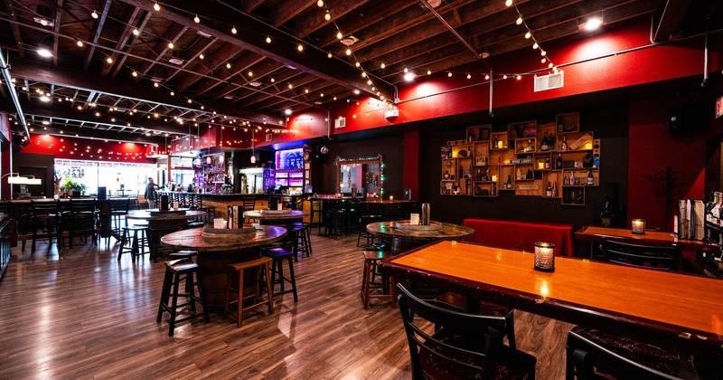 Interior, open space dining area, tables and chairs ready for guests, various decoration