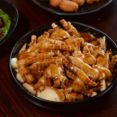 Poutine fries topped with gravy.