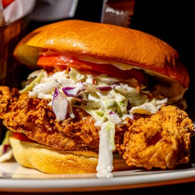 Fried chicken sandwich with coleslaw.