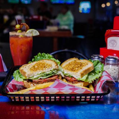 BLT sandwich and fries on the side.