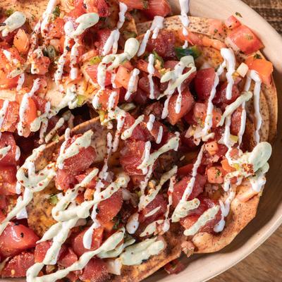 Ahi tuna nachos, with pico de gallo, avocado cream, horseradish, and taro chips.