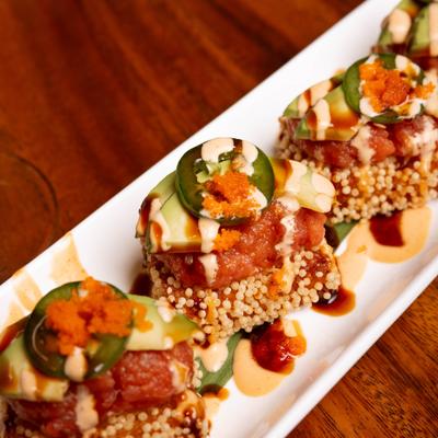 Crispy Tuna Rice topped with jalapeno slices.