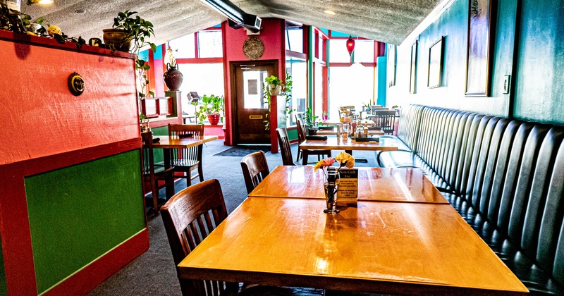 Interior, tables, chairs and leather high back benches