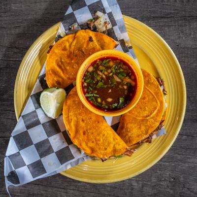 Birria Tacos with consomme, top view.