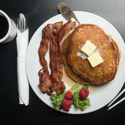 Pancakes, with butter, and bacon.