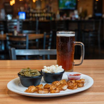 Grilled shrimp and mug of beer.