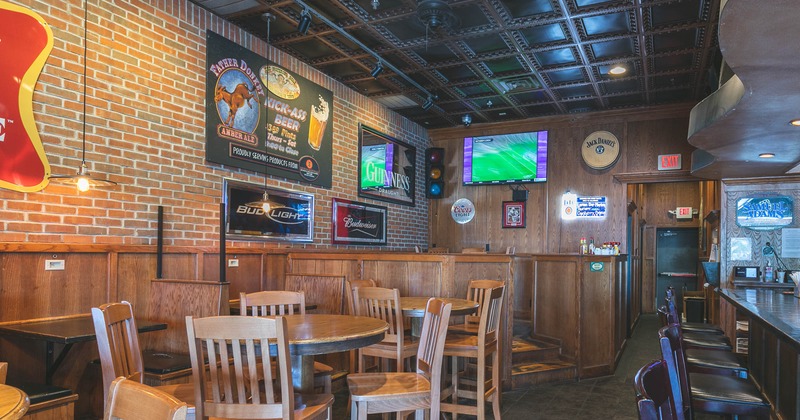 Interior, dining area, booths on the left and bar on the right