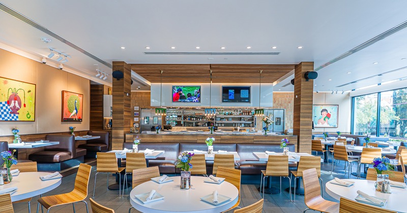 Spacious and cozy interior dining area with set dining tables