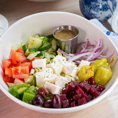 Greek Salad, with beets, tomato, red onion, feta, lettuce, and pepperoncini.