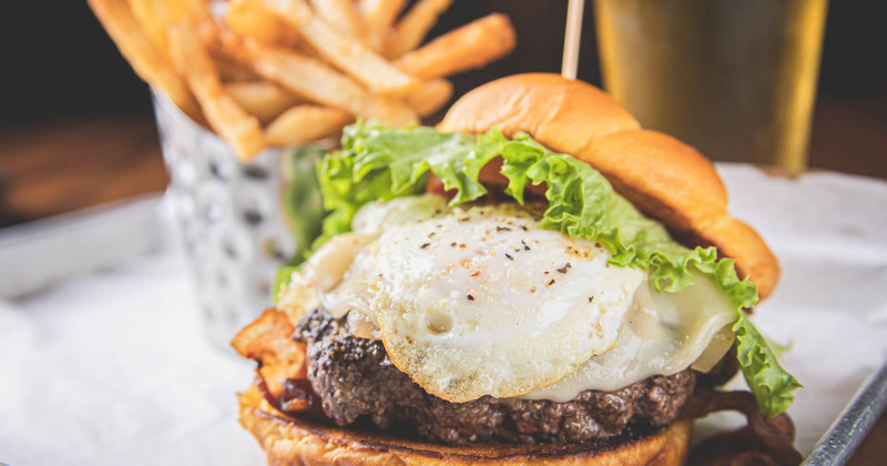 Burger with ,eat and fries eggs