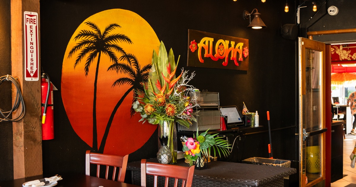 Tables, chairs, and tropical flowers