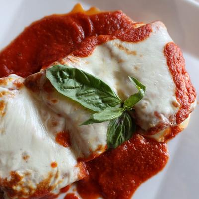Breaded eggplant rolled and stuffed with ricotta, smothered in tomato sauce and mozzarella.