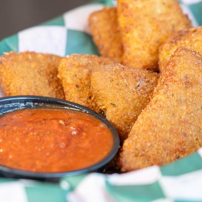 Fried mozzarella served with a side of marinara sauce.