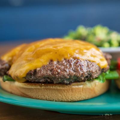 Close up shot of  a handmade burger on a plate.