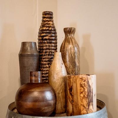 Various wood carved vases.