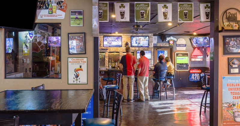 Interior, bar and seating area, guests having fun