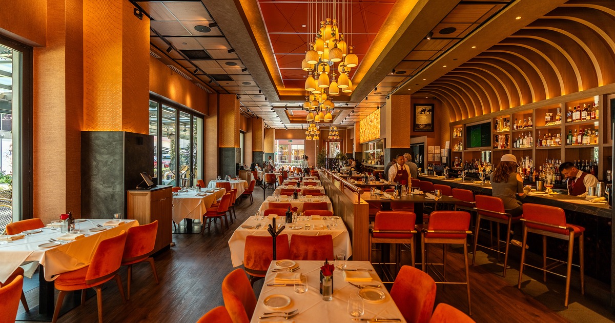 Modern and cozy interior dining area with set tables ready for guests