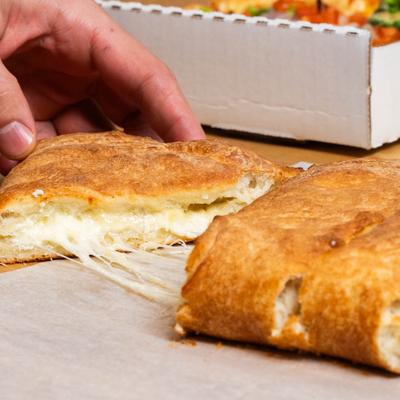Calzone on a table, close up.