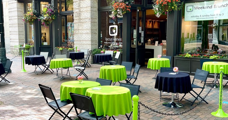 Exterior, seating area, green and black tables