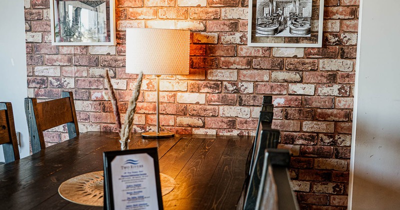 Interior, table for six, with pictures on the wall