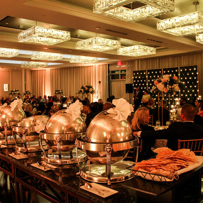 Catering tables full of food in heaters