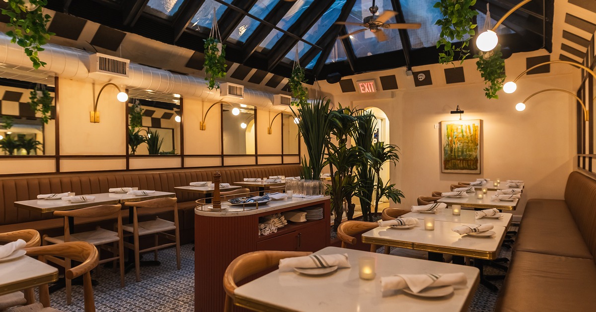 Modern style of dining area interior design with set tables