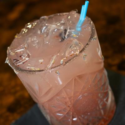 Lavender Haze cocktail served in a rocks glass, close-up.