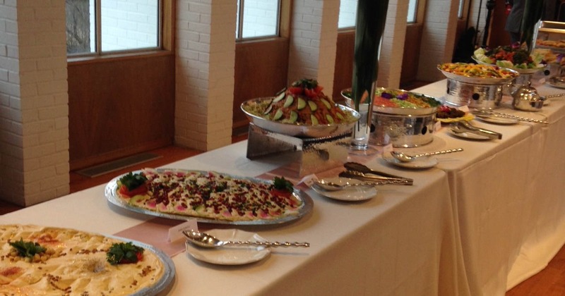 A diverse buffet table filled with an assortment of dishes