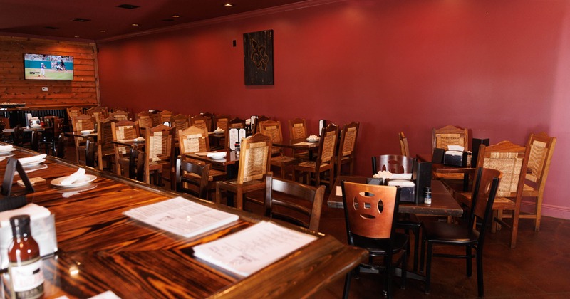 Interior of a restaurant featuring wooden tables and chairs