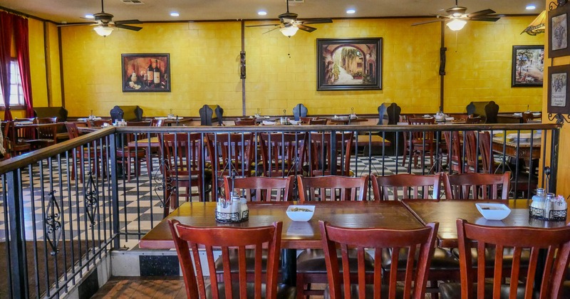 Interior, dining area, table for eight, ready for guests, open space dining area in the back