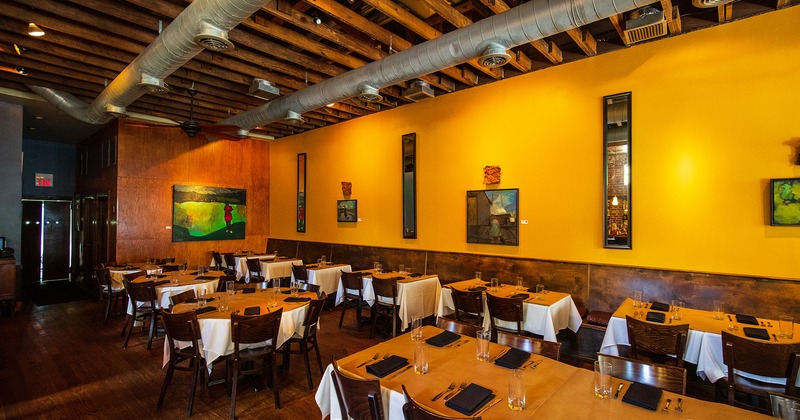 Interior, set tables and seats, paintings on walls