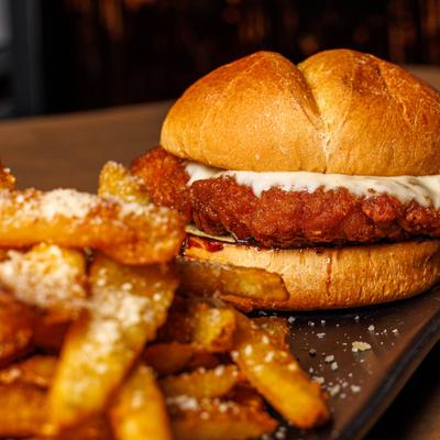 Chicken sandwich with fries.