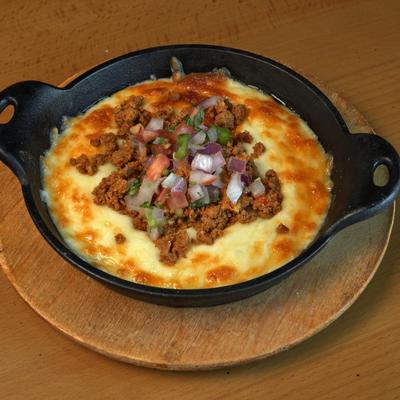 Melted cheese dip with ground sausage.