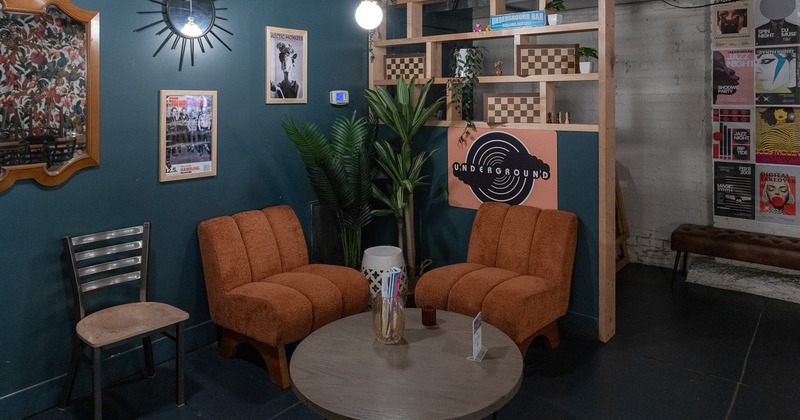 Lounge seating area in the corner with two armchairs and a round table