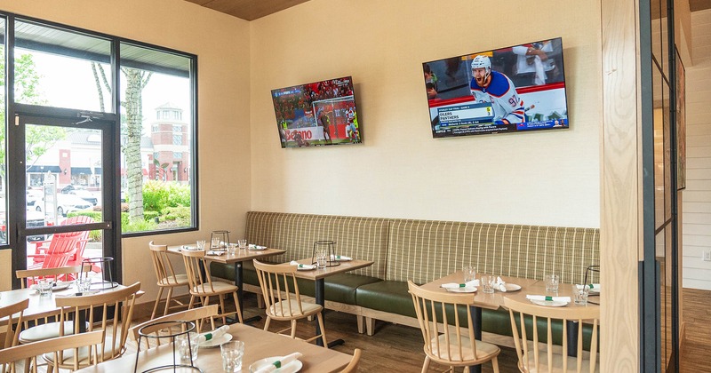 Restaurant interior, dining area with set dining tables ready for guests