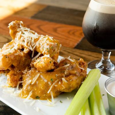 Garlic parmesan boneless chicken wings, with celery and dressing.
