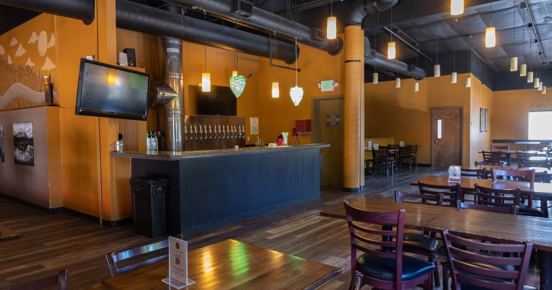 Bar with beer taps, tables and seats