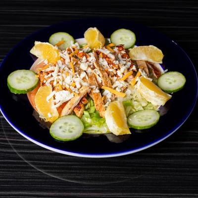 Grilled shrimp salad with vegetables and shredded cheese