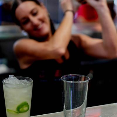 A bartender preparing cocktails.