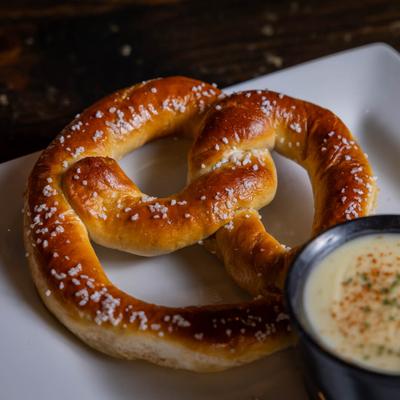 Baked jumbo pretzel with cheese dip.