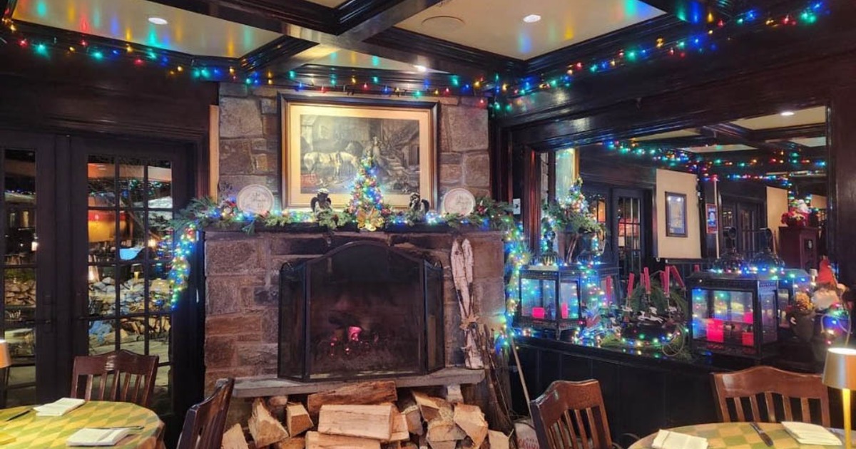 Interior, seating and fireplace with light decorations